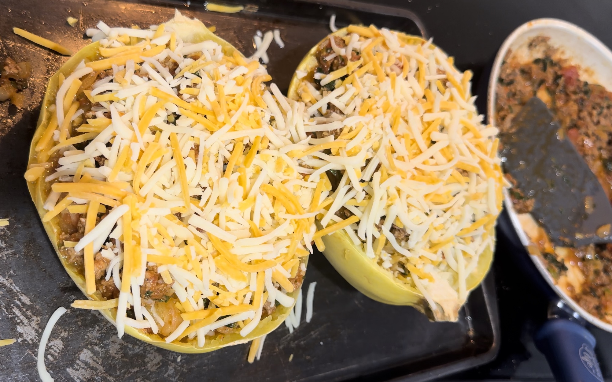 Unmelted shredded cheese on spaghetti squash 