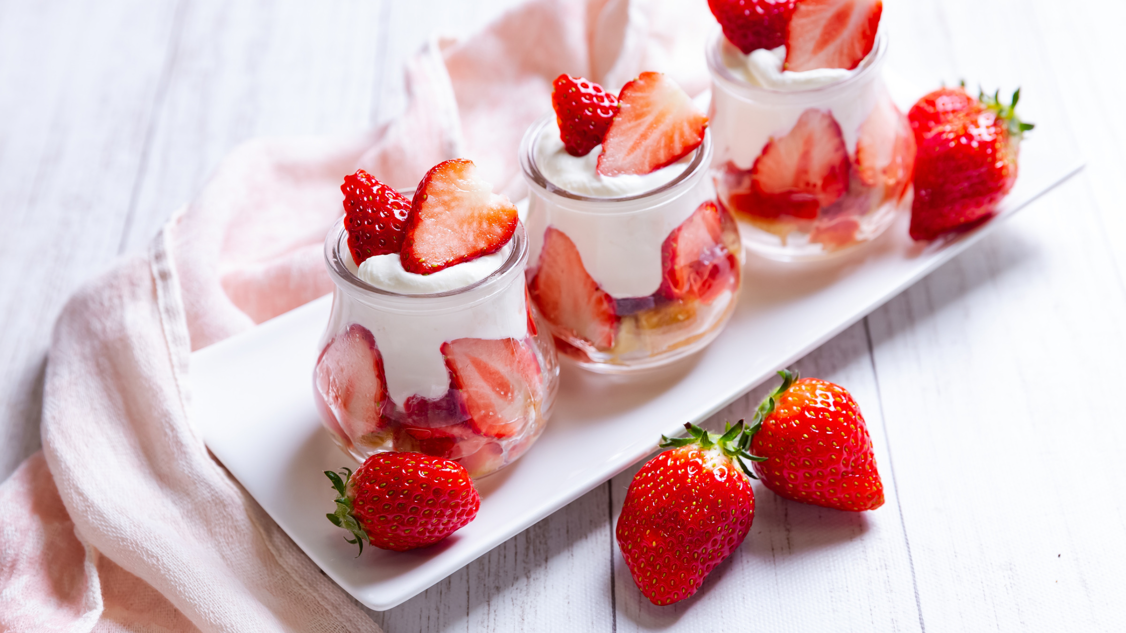 Stylized Cheesecake parfait with strawberry slices 