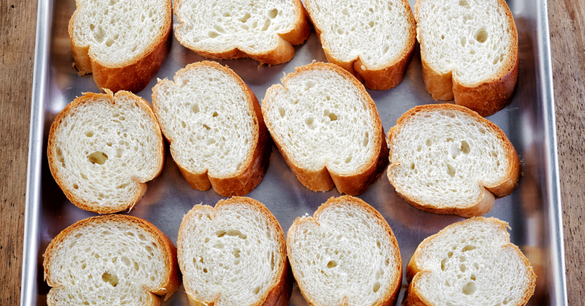 Slices of bread on a cookie sheet