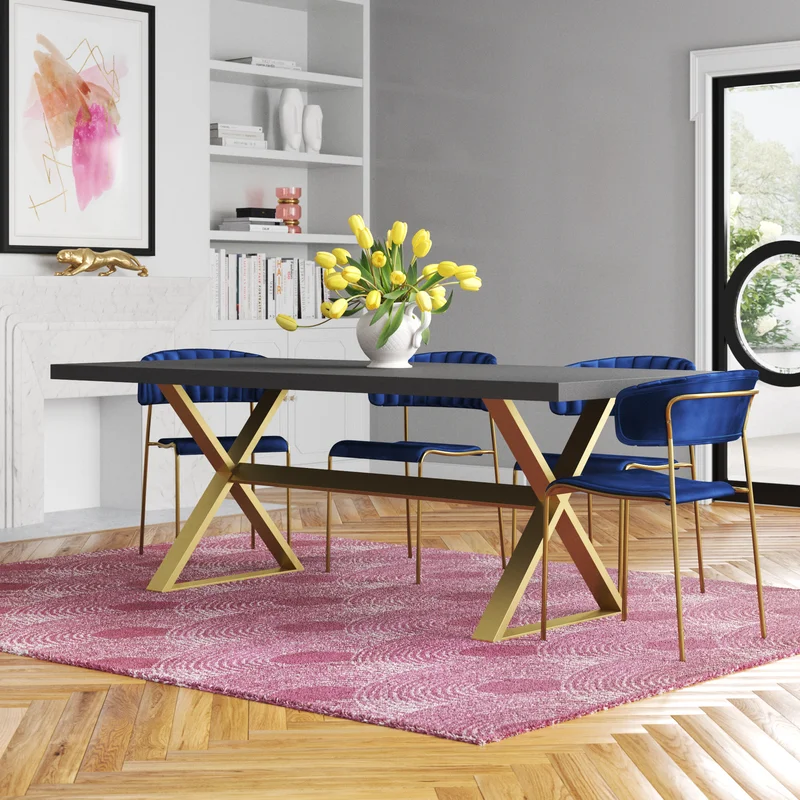 A 8 seater table with black top and gold base, everly Quinn