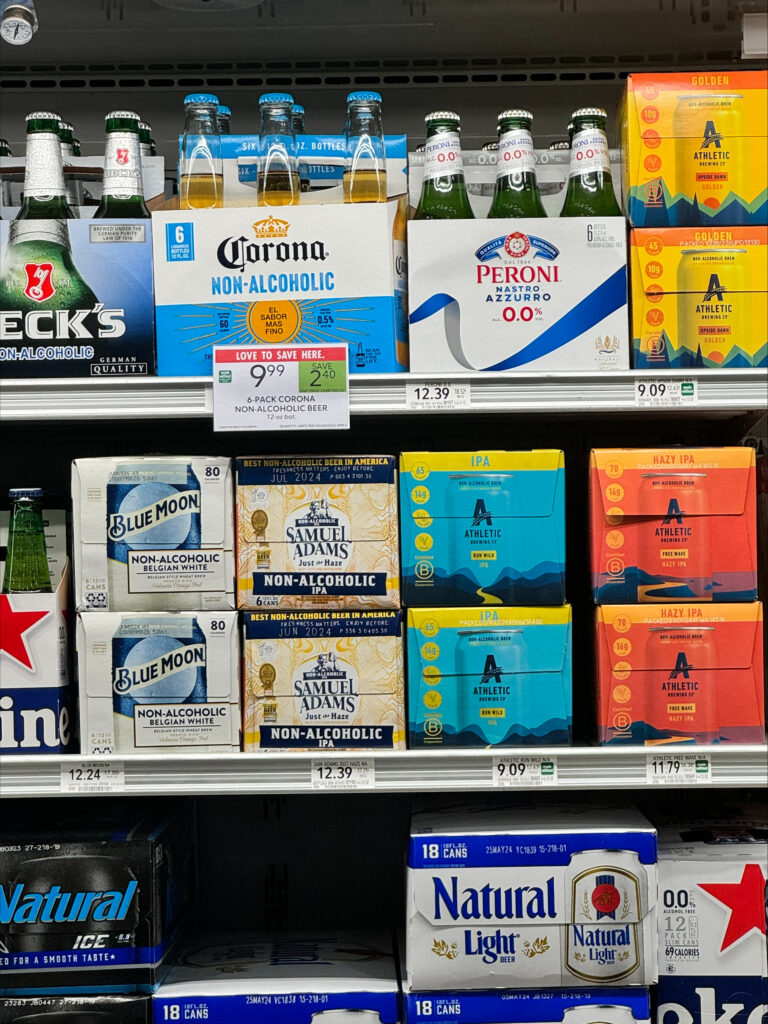 Sober curious - shelf full of non-alcoholic beer at a retail store