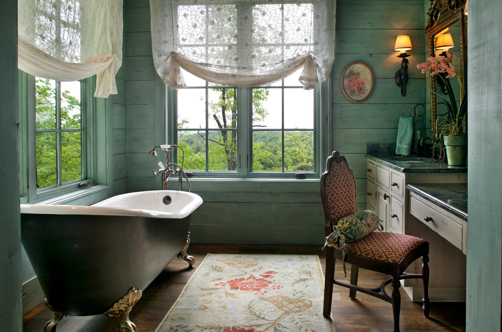 a bathroom with a tub and a chair