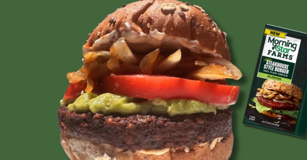 MorningStar farms steakhouse style burger with guacamole, carmelized onions, tomato and mayo