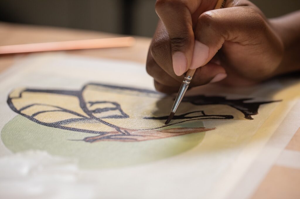 Artist painting on canvas , artxadanna